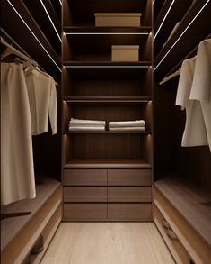 an empty walk - in closet with clothes hanging on the shelves and folded linens