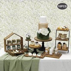 a table topped with lots of cakes and cupcakes