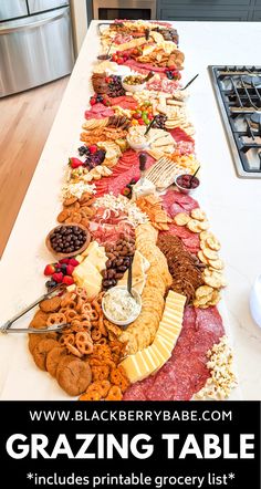 a long table filled with lots of different types of food on top of each other