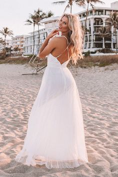 Turn heads in our gorgeous white 'True Romance' maxi dress featuring lightweight layered material with a beautifully pleated under layer and a dainty tulle top layer, a deep v-cut neckline, adjustable spaghetti straps that cross a deep open back, a fitted waistline, and a flowy skirt silhouette that cascades into an uneven floor-length hemline! Measurements S : Bust 28", Hip 36", Length 56", Waist 27". M : Bust 30", Hip 38", Length 57", Waist 29". L : Bust 32", Hip 40", Length 58", Waist 31".