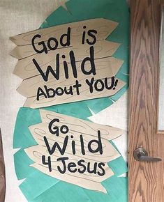 two signs that say god is wild about you and go wild for jesus on the door