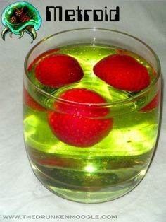 three strawberries floating in a bowl of water with the words metroid above them