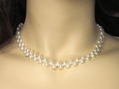 ( Prices in Canada are taxes included. ) 6 & 7 mm white half round genuine pearl necklace JNHRBA665 & JNHRBA775 PRODUCT INFORMATION: * Pearl Type: Genuine freshwater pearls with natural luster. * Pearl Color: White. * Clasp: Rhodium plated. * Pearl Shape and Size: Half Round freshwater pearls 6-6.5 & 7-7.5mm(approx.). * Pearl Luster: Good Luster. * Length: 16".  * Material: Genuine freshwater pearl. PROCESSING TIME & SHIPPING * Processing time: 1 to 4 business days. * Item will be shipped via Ca Pearl White 8mm Beads Jewelry Gift, Round Pearl Jewelry With 8mm Beads, Pearl White Jewelry With 8mm Beads As Gift, Pearl White Jewelry With 8mm Beads For Gift, Elegant 8mm Beads Jewelry For Formal Occasions, Classic Formal Pearl Choker Necklace, Pearl Necklace With Round Beads For Jewelry Making, Classic Adjustable Jewelry With 8mm Beads, Classic Adjustable 8mm Beads Jewelry