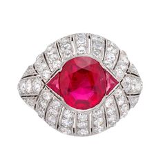 A French Art Deco ruby and diamond ring, the central oval faceted ruby weighing 3.88 carats, accompanied by report stating its origin to be from Mogok, Burma, set between two triangular-shaped straight-side faceted rubies weighing a further total of 0.17 carats, set to a bombe-style mount pave-set with old brilliant-cut diamonds estimated to weigh 2.45 carats in total, all mounted in platinum with tapered D-sction shank, bearing French platinum mark, circa 1930, measuring 1.8 s 2.2cm, finger siz Bijoux Art Deco, Ruby Jewellery, Art Deco Rings, Deco Rings, Mogok, Art Deco Jewellery, Ruby And Diamond Ring, Ruby Rings, Nouveau Jewelry