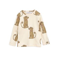 This off-white top is crafted in 100 % GOTS certified organic cotton. Featuring long sleeves and a dainty cocker spaniel print. • Snap buttons at shoulder in size 56/62–68/74 for easy dressing • 100 % organic cotton • GOTS certified • Made in Portugal Since we are working with products that are mainly used by children, the control of chemical use is of the utmost importance to us. This t-shirt is GOTS certified – the strictest certification for organic material on the market today, which involve Boys Romper, Mini Rodini, Girls Long Sleeve, Spaniel, Simple Dresses, White Tops, Baby Boy Outfits, Long Sleeve Tee, Jumpsuit Dress