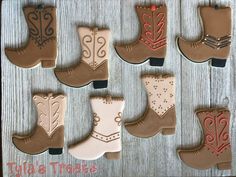 decorated cookies in the shape of cowboy boots