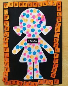 an art project made out of paper with the word emma on it's face