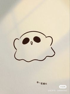 a drawing of a skull with eyes drawn on it's face and in the shape of a ghost