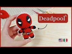 someone is holding up a crocheted deadpool keychain