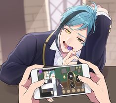 a person with blue hair is holding a cell phone and looking at something on the screen