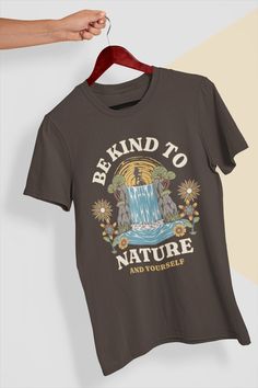 "Looking for a stylish and eco-friendly way to celebrate Earth Day or show your love for the great outdoors? Look no further than our \"Be Kind To Nature\" t-shirt! Crafted from soft and breathable cotton, this shirt is perfect for hiking, camping, or simply enjoying a walk in the park. Its eye-catching design features the words \"Be Kind To Nature\" in bold, earthy tones, reminding us of the beauty and importance of our natural world. As an environmentalist, mindfulness enthusiast, or lover of Earth Day Shirt, Hiking Tshirt, T Shirt Painting, Tshirt Design Inspiration, Shirt Design Inspiration, Nature Shirts, Walk In The Park, Yoga Tank Tops, Nature Kids