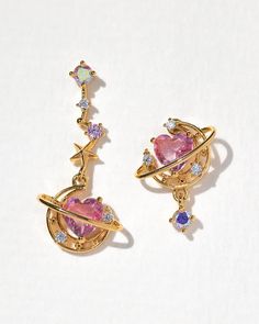 These mismatched earrings pair perfectly together to give you a look that is out of this world!18k gold plated over brass with a protective coatingCubic zirconia stones. Gradient stones may vary in hues of pink, purple and blueSterling silver posts and butterfly backings2.5cm length Earrings Double Piercing, Double Piercing Earrings, Mismatch Earrings, Double Piercing, Dinosaur Earrings, Earrings Double, Piercing Earrings, Buy List, Fruit Earrings