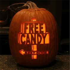 a carved pumpkin with the words free candy on it