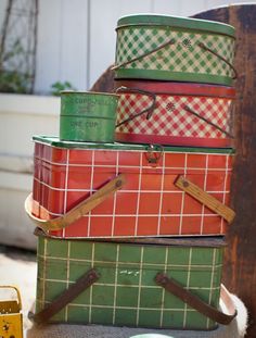 a stack of tins sitting on top of a table