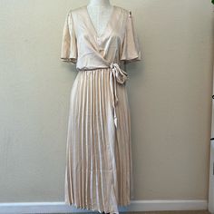 Nwt Petite Short Sleeve Pleated Belted Satin Midi Dress. V Neck Line With Open Back And Tie Waist. 100% Polyester. Brand New Never Worn. Size: Petite Medium Color: Champagne Beige Pleated V-neck Maxi Dress, Formal Summer V-neck Pleated Dress, Formal Summer Pleated V-neck Dress, Formal V-neck Pleated Dress For Summer, Chic Short Sleeve Pleated Dress For Spring, Beige Pleated V-neck Midi Dress, Chic Beige Pleated Spring Dress, Chic Beige Pleated Dress For Spring, Beige Pleated Midi Dress With V-neck