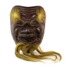 an old mask with yellow hair on it