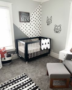 a baby's room with a black and white theme