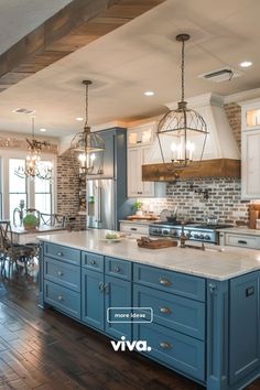 a large kitchen with blue cabinets and white counter tops is featured in the ad for viva