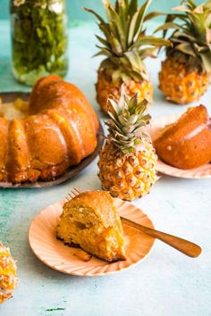 pineapple bundt cake on plates next to sliced pineapples and jar of pickles