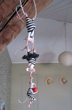 a wind chime hanging from the ceiling in a room