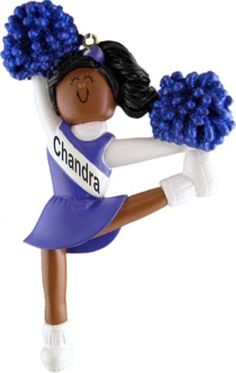 a christmas ornament with a cheerleader holding a pom - pom