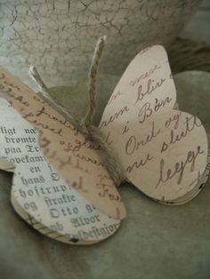 an image of two paper butterflies with words on them and one has been altered to look like