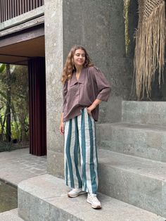 Channel the spirit of the '80s with the Retro Pants from the Half Moons collection by Erica Kim. Featuring bold green stripes and handwoven cotton, these pants offer a nostalgic nod to retro culture while maintaining a modern, artisanal feel. Hand-block printed and naturally dyed, they’re crafted with an elasticated waist for comfort and a straight hem for a tailored touch. Perfect for creating a laid-back yet stylish look, these pants are a versatile addition to your wardrobe. Made from 100% or Erica Kim, Half Moons, Retro Pants, Moon Collection, Handwoven Fabric, Naturally Dyed, Shirt Skirt, Green Stripes, Stretchy Fabric