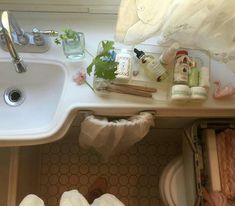 the sink is full of toiletries and personal care items