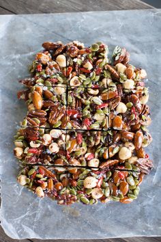 nuts and seeds are arranged on top of each other in the shape of a square