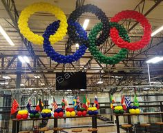 the olympic rings are hanging from the ceiling