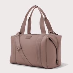 The weekend is nigh and youre ready for a much-needed getaway. Whether youre off to commune with nature in a cabin by the woods or jetting to Paris for a stylish urban excursion, our large Landon Carryall has you covered. This lightweight bag is designed to support you on any journey, modest or immense, and unsnaps at the sides to create more room for any unexpected finds you cant leave behind. It also includes a padded laptop sleeve, an air mesh pouch for all your essentials and a water bottle Mesh Pouch, Dagne Dover, Nursing Wear, Copper Pearl, Lightweight Bag, Carry All Bag, Long Weekend, Baby Bibs, Baby Wearing