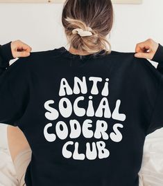 Looking for a comfortable and stylish way to show off your love for coding and your anti-social tendencies? Look no further than this "Anti Social Coders Club" crewneck!. Made from a soft and cozy blend of materials, this hoodie features a bold and wavy-style design that's sure to make a statement. With its comfortable fit and durable construction, this hoodie is perfect for wearing while you work on your latest coding project, attend programming meetups, or just relax at home. The "Anti Social Coders Club" slogan in bold and wavy-style font is perfect for those who want to show off their love for coding and their independent spirit in a unique and eye-catching way. With keywords like "programmer", "coding", "anti-social", and "wavy-style", this hoodie is sure to catch the attention of fel Coding Stickers, Coding Design, Coder Girl, Science Major, Company Ideas, Medical Coder, Wavy Style, Web Developer, Software Engineer