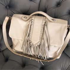 Sam Edelman New!!! Nwot!!!!!! Beautiful!!!!! Ivory, Light Beige, Silver Hardware Leather Fringe Details On Front Foldover Top With Magnetic Button Closure Large Single-Back Slip Pocket Inner 1 Zip Pocket Approx. 10" H X 13" W X 4" D 1.25" Handle Drop 11" Strap Drop Leather Fringe, Satchel Bag, Light Beige, Silver Hardware, Satchel Bags, Sam Edelman, Zip Pockets, Satchel, Bag Lady