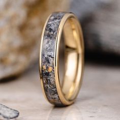 a wedding ring made out of antler and gold