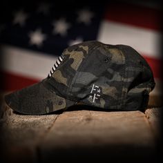 BLACK MULTICAM FULL FABRIC AMERICAN FLAG RANGE HAT 🇺🇸 Made In The USA A must-have for range days, our range hats are built for shooters. The black MultiCam ripstop fabric will protect your head from sharp brass while the buttonless crown will not interfere with ear protection or cause head pain. Vintage washed for that worn-in look and feel, our full fabric black MultiCam range hat is embroidered with an American flag on the front and our logo over the left ear. We partner with a multi-generat Military Style Baseball Cap For Outdoor, Military Style Baseball Cap For Outdoor Activities, Military Flat Bill Hat For Outdoor Activities, Military Hat With Flat Bill For Outdoor Activities, Military Style Flat Bill Baseball Cap For Outdoor Activities, Military Snapback Baseball Cap For Outdoor Activities, Military Style Baseball Cap With Short Brim, Military Snapback Hat For Outdoor, Military Style Snapback Hat For Outdoor