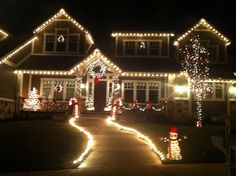 a house decorated with christmas lights and decorations