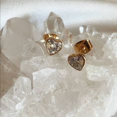 Crafted in Los Angeles, the Tramps+Thieves Hecate Studs feature 18K gold plating and shimmering clear CZ heart stones. A symbol of sophistication and luxury, these earrings offer an exclusive design for the discerning individual. Heart Stones, Stone Heart, Gold Plating, Exclusive Designs, 18k Gold, Gold Plate, Angeles, Plating, Stone