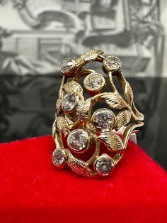 14k Yellow Gold Art Nouveau Diamond Ring Material: 14k Yellow Gold Gemstone: Diamond (Old European Cut) Total diamond carat weight: 1.12 carats (approximately - stones in mounting) Ring size: 6.75-7 (US sizing) (fits more as a size 7 due to its shape) Total weight: 6.6 grams Time period of origin: 1900's We have a GIA gemologist on our team. All jewelry items are authenticated. Victorian Diamond White Ring With 17 Jewels, Art Deco Gold Cluster Ring With Rose Cut Diamonds, Victorian 14k Gold Cluster Ring For Anniversary, Antique Yellow Gold Filigree Ring With 17 Jewels, Antique Diamond Ring With Accents For Vintage Events, Elegant Diamond Filigree Ring Collectible, Antique Cluster Ring With Diamond Accents, Victorian Diamond Cluster Ring, Elegant Diamond Filigree Ring For Collectors