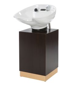 a white sink sitting on top of a wooden stand