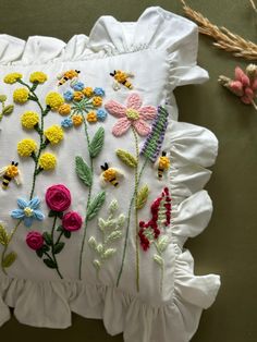 a decorative pillow with flowers on it