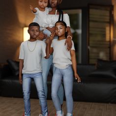 a group of people standing next to each other in front of a living room filled with furniture