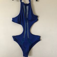 Nwot Blue Cut Out Halter Swimsuit. Small. Sheer Panel Inserts From Neckline To Bottom Of Swimsuit. Halter Tie Cut Out Back. Very Cute And Sexy For That Daring Fun Occasion. Blue Stretch One-piece For Party, Blue Halter Neck Bodysuit For Party, Blue Nylon Bodysuit For Pool, Blue Stretch Cutout Swimwear, Blue Backless One Piece With Lined Body, Blue Backless Bodysuit For Night Out, Blue One-piece Lined Bodysuit, Blue One-piece With Lined Body For Spring, Blue Fitted Bodysuit For Beachwear