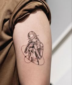 a woman's arm with a tattoo on it that has an image of a human being