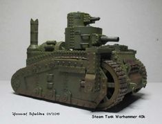 a toy tank is shown on a white surface