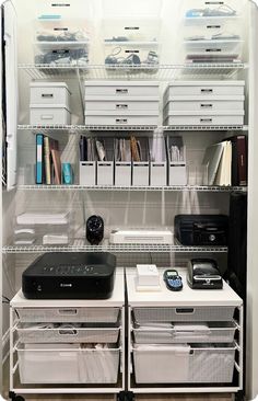 an organized closet with drawers, file cabinets and other items