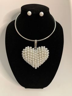 White Pearl Heart Choker Necklace Set Color: White/Silver Size: 6"W, 6"L, 3"Ext. Earring Size: 0.5"L, Post Chunky Heart Pearl Choker Necklace, Big Pearl Necklace, L Post, Heart Choker Necklace, Big Pearl, Pearl Heart, Heart Choker, Choker Necklace Set, Pearl Choker Necklace, Pearl Choker