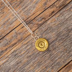 Surprise your favorite firearms enthusiast with this creative .243 brass casing pendant. This style of pendant is a great way to recycle your used bullet shells. We are happy to supply you with the brass casing, or you can send us your used rounds and we'll a bullet pendant from your casing. This unique bullet jewelry makes for a great gift for the special hunter in your life!DETAILS OF THE PENDANT Bail: Sterling Silver Profile: Flat Finish: PolishedBrass Casing: .243Pendant Diameter: 11.85 mm P Shell Casing Art, 22 Shell Casing Crafts, Shell Casings Crafts, Hunting Pics, Bullet Casing Crafts, Shotgun Shell Crafts, Bullet Casing Jewelry, Bullet Crafts, Bullet Art