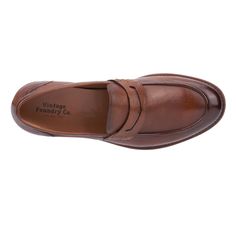 Boost your confidence with the Harry penny loafer. Featuring a genuine leather silhouette complemented by an antique outsole, this loafer exudes timeless elegance. Its classic design ensures it will quickly become a favorite in your wardrobe. Perfect for any occasion, the Harry penny loafer effortlessly combines sophistication and comfort, elevating your style with every step. Classic Brown Plain Toe Slip-ons, Timeless Formal Moccasins With Brogue Detailing, Timeless Formal Goodyear Welted Moccasins, Formal Timeless Goodyear Welted Moccasins, Masculine Moc Toe Slip-ons For Formal Occasions, Classic Business Slip-ons With Plain Toe, Timeless Moccasins With Leather Sole, Timeless Slip-on Dress Shoes With Plain Toe, Timeless Slip-on Dress Shoes For Semi-formal Occasions