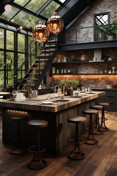 a kitchen with lots of counter space and stools in front of the bar area