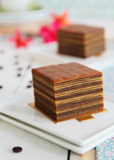 three slices of cake sitting on top of a white plate